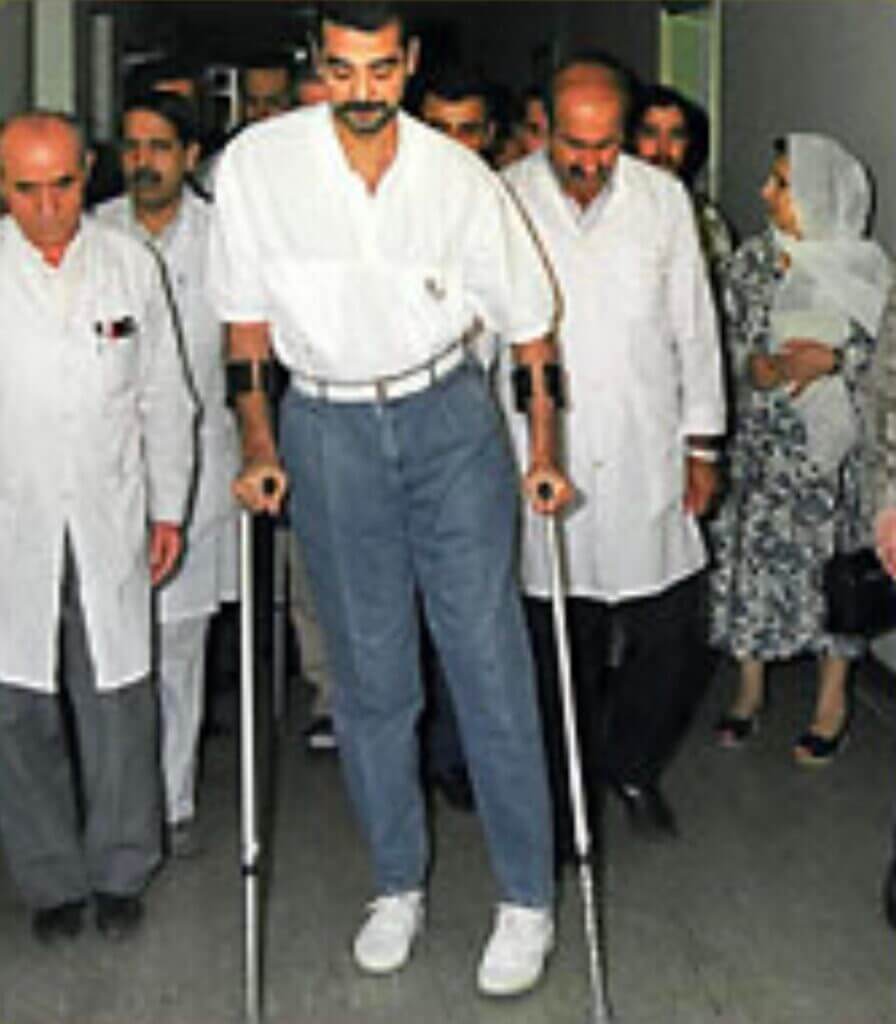 man with arm crutches 